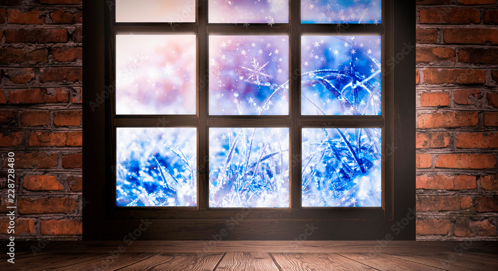 The window is frozen, frosty morning, snowflakes on the glass, an empty room with a window, an old brick wall and a wooden floor. Part of the background is a cozy interior. Sunlight squared frozen win The window is frozen, frosty morning, snowflakes on the glass, an empty room with a window, an old brick wall and a wooden floor. Part of the background is a cozy interior. Sunlight squared frozen win