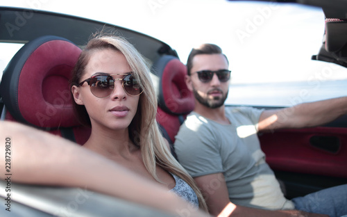 close up.the couple traveling in a convertible © ASDF