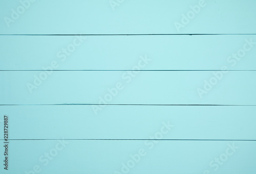 Top view light green wooden background.