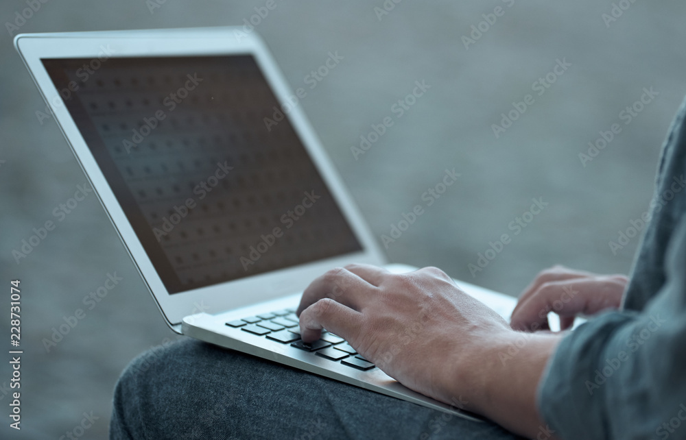 Student typing on the keyboard.