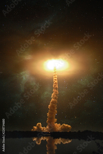Fotografija Spaceship launch at night, landscape with colorful smoke clouds and galaxy background collage