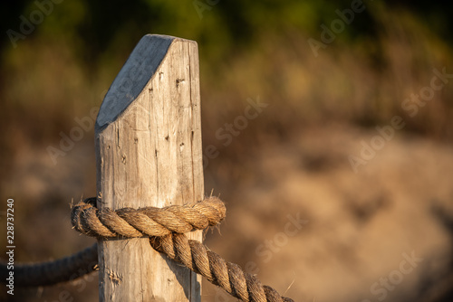 wooden pole with rope © Zuska