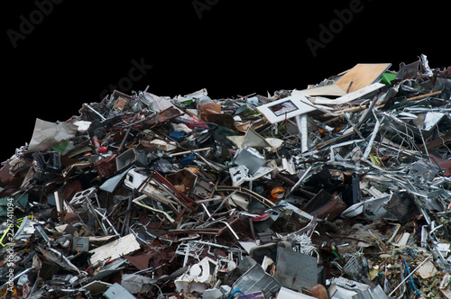 Fotografie Pile of discarded trash on a black background
