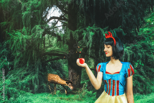 Принти на полотні Snow White cosplay girl in the mysterious forest