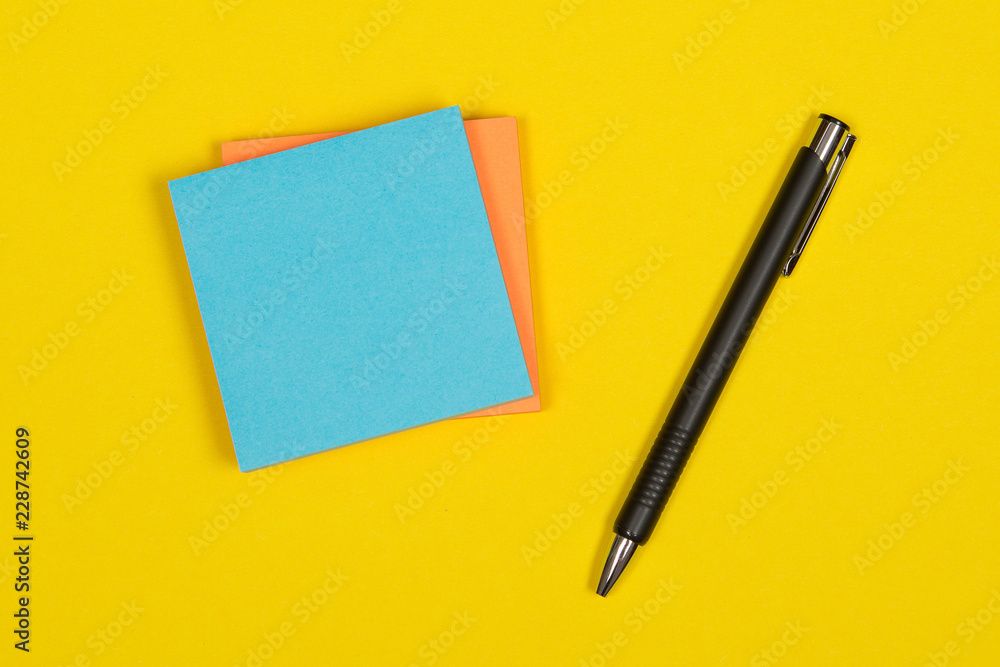 Colorful postit note on a yellow background Colorful postit note on a yellow background