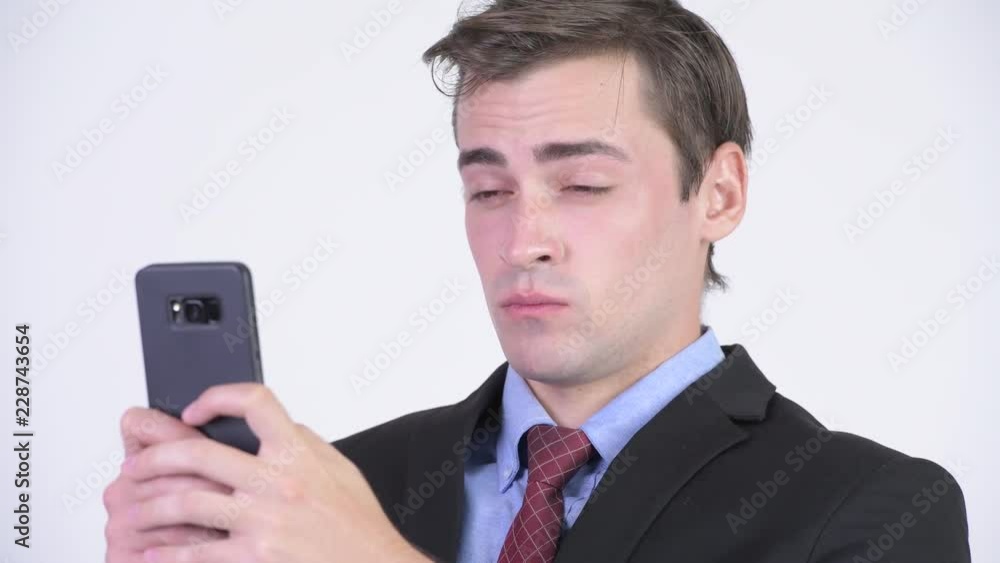 Young happy handsome businessman using phone Young happy handsome businessman using phone