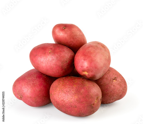 Bunch of red potatoes close up on a white. Isolated