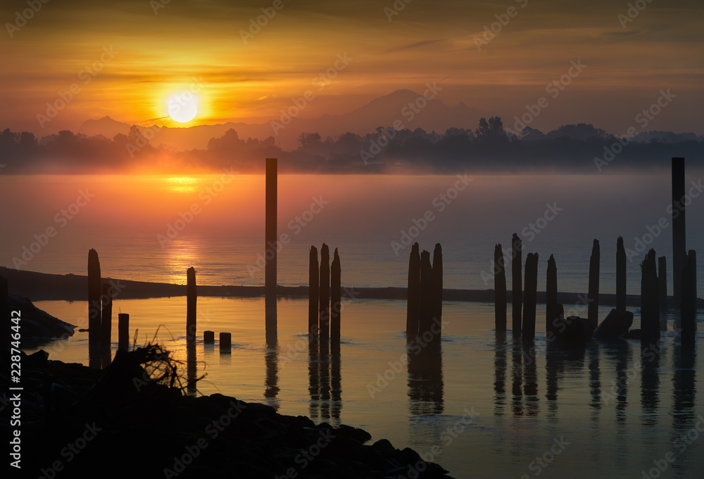 Mt. Baker, Fraser River Sunrise. Early morning calm on the Fraser River, British Columbia.

