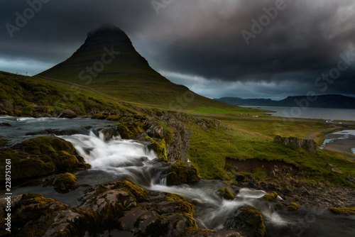 Kirkjufell volcano the coast of Snaefellsnes peninsula. Picturesque and gorgeous scene. Location Kirkjufellsfoss, Iceland, sightseeing Europe. Breathtaking picture of the popular tourist attraction