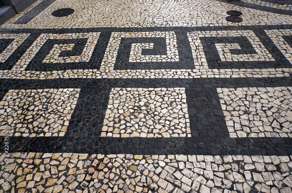 Fototapeta premium Mosaic tiles pavement in Funchal, Madeira, Portugal.