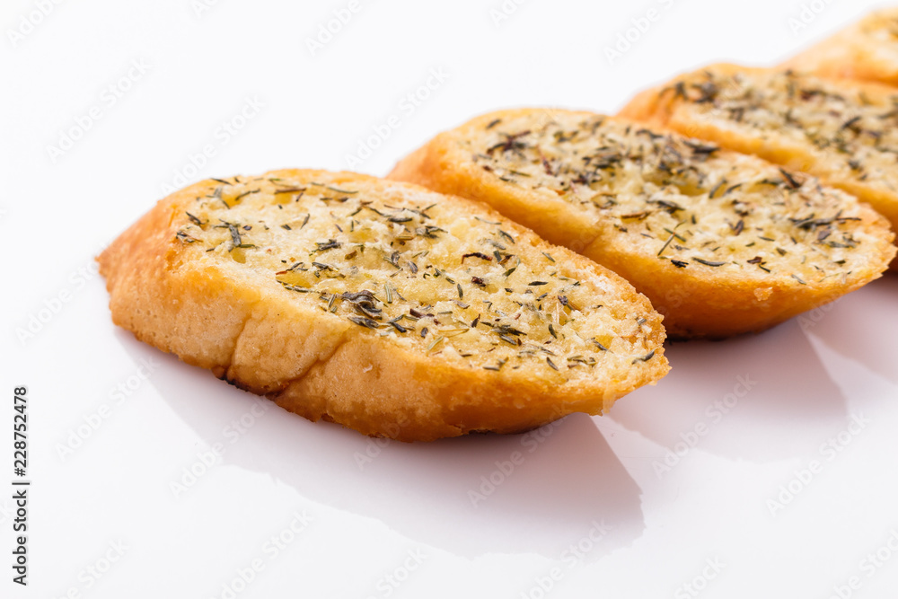 fragrant garlic bread on a white acrylic background fragrant garlic bread on a white acrylic background