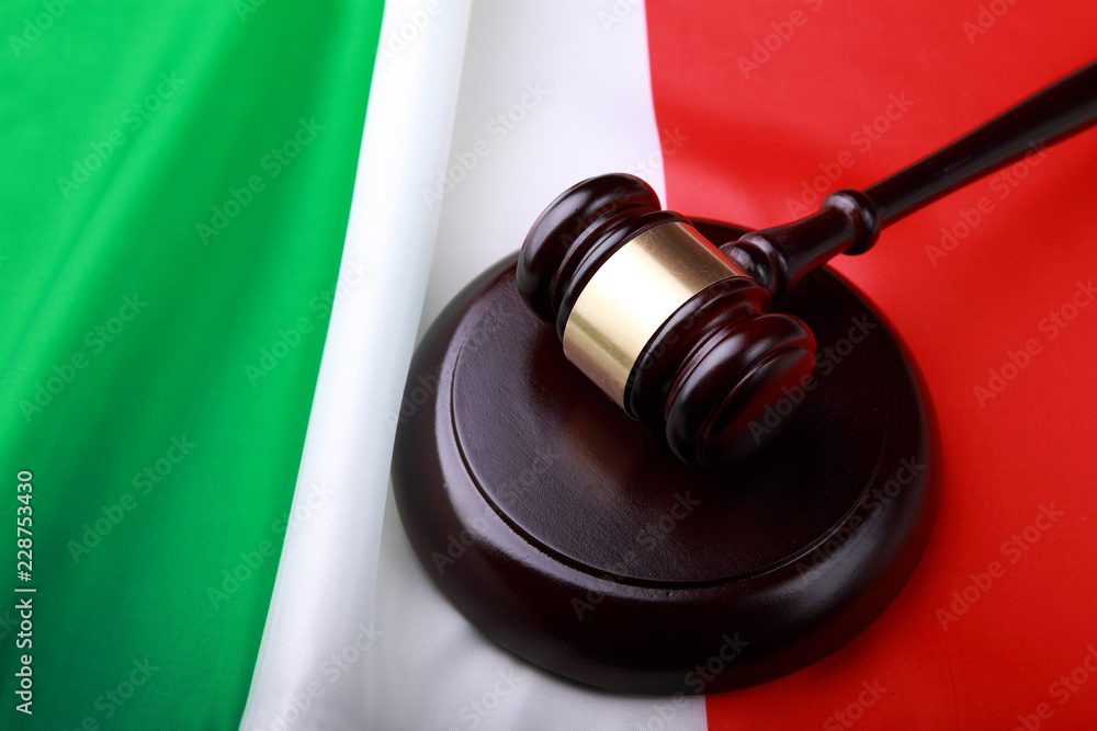 Gavel on the flag of Italy
