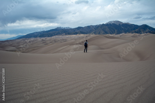 Person exploring sand dunes