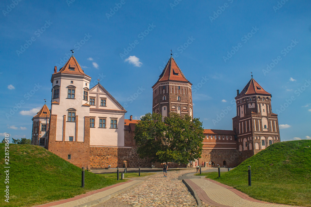 View of the Mir castle on a beautiful sunny day of a summer in  in the region of Grodno, in Belarus - Gothic style, the fortification is an UNESCO heritage site, also known as Mirsky zamok.