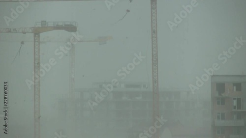 Cranes swaying under a strong wind (120km/h - 70mph) photo