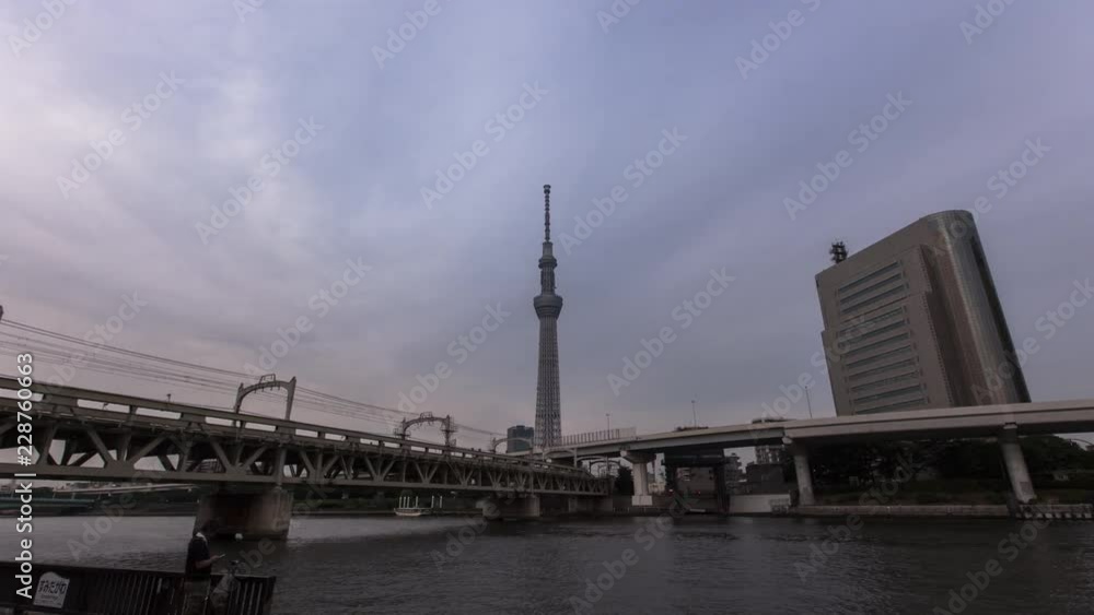 Time Lapse of Tokyo Skytree with Sumida River and bridge in foreground, Tokyo, Japan Time Lapse of Tokyo Skytree with Sumida River and bridge in foreground, Tokyo, Japan