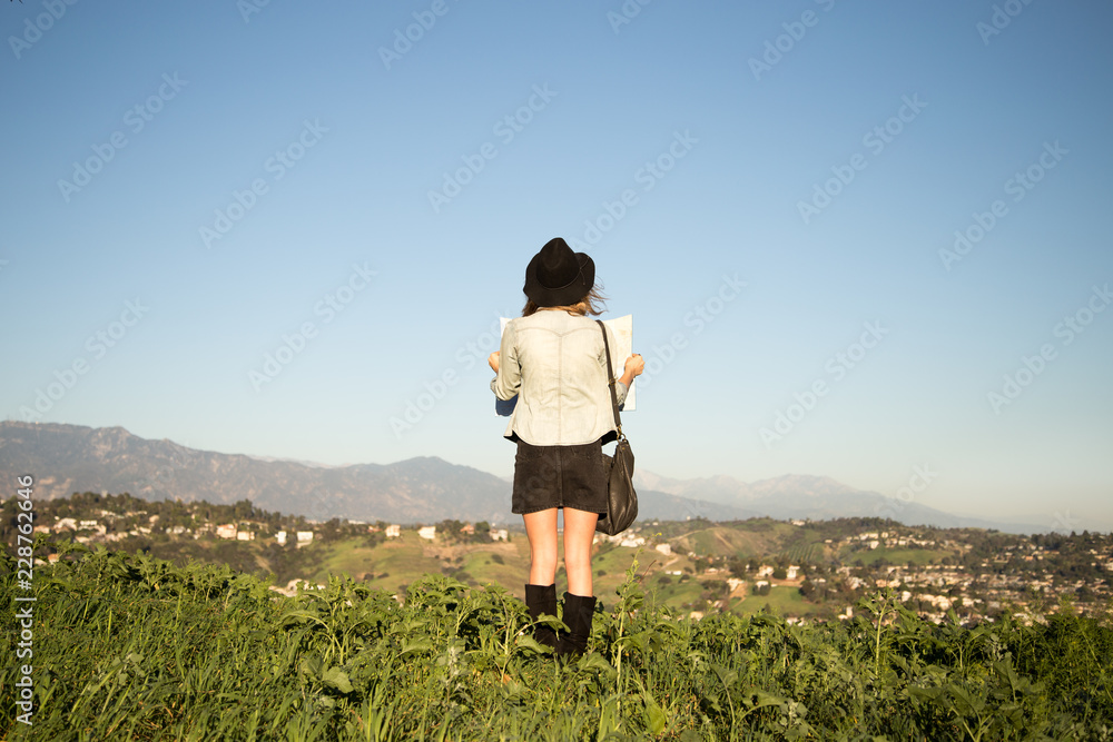 Fototapeta premium woman explores the hills
