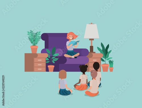 students sitting in the livingroom reading book