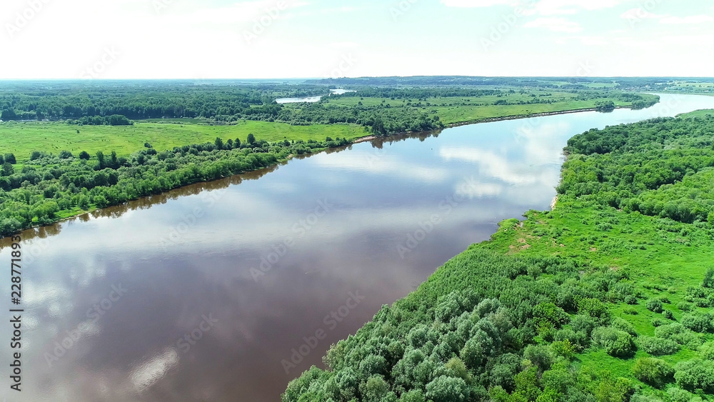 Beautiful natural scenery of river and green forest aerial view.