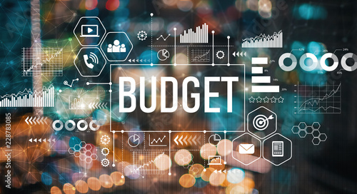 Foto Budget with blurred city abstract lights background