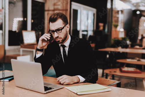 Project. Business Suit. Talking on Phone. Laptop.