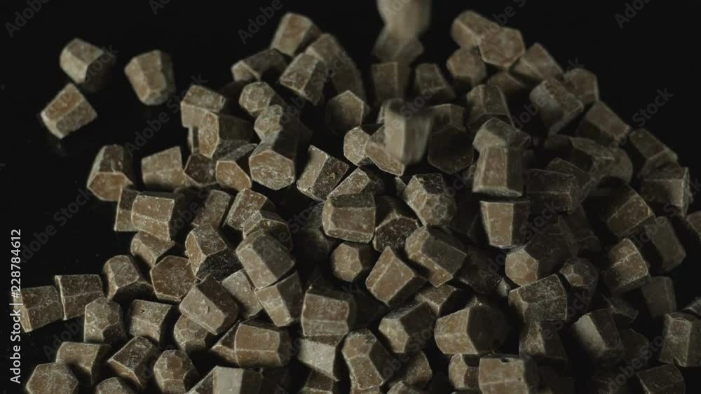 Chocolate slices cubes shaped isolated on black. Chocolate slices cubes shaped isolated on black.