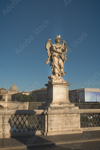 View of Vittorio Emanuele bridge on the Tiber river and St. Peter's Basilica in Vatican from saint angel bridge