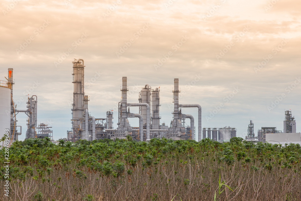 Oil and gas refinery industry plant, Power electric factory, Chemical storage tanks and sunlight. Oil and gas refinery industry plant, Power electric factory, Chemical storage tanks and sunlight.