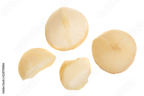 Shelled macadamia nuts isolated on white background. Top view. Flat lay pattern