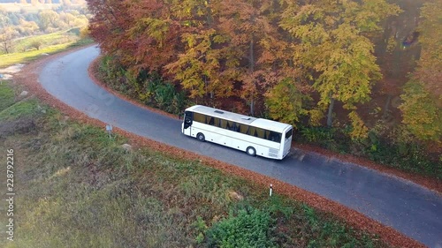 Bird's-eye view of a tourist bus on a mountain road