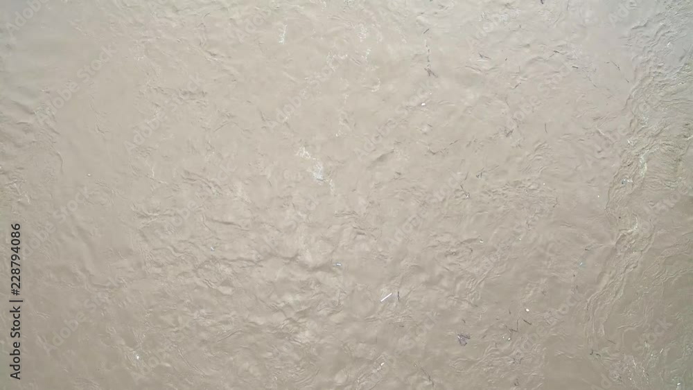 Aerial view. Background or texture dirt water texture in the river, the view from the dron Aerial view. Background or texture dirt water texture in the river, the view from the dron