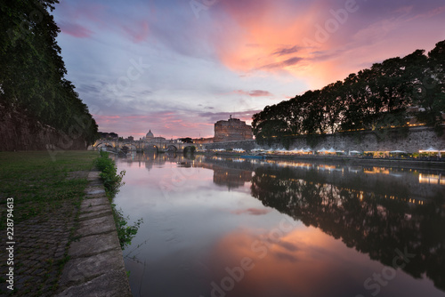 Vatican City, Rome, Italy, Beautiful Vibrant Night image Panorama of St. Peter's Basilica, Ponte St. Angelo and Tiber River at Dusk in Summer. Reflection of The Papal Basilica of St. Peter