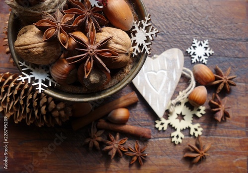 Decorative Christmas , nuts, cinnamon and anise stars. Christmas time . Seasonal and holidays concept 