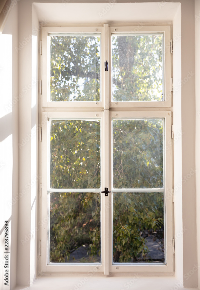 Fototapeta premium White old fashioned wooden window on white wall