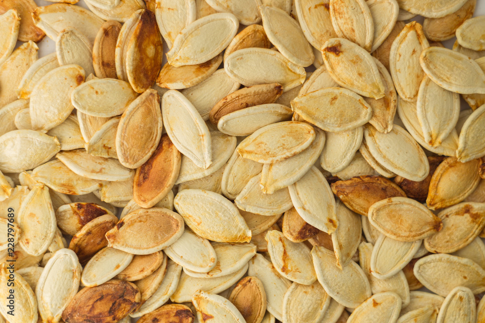 texture of white,yellow pumpkin seeds texture of white,yellow pumpkin seeds