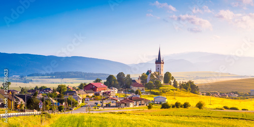 Obraz na płótnie Beautiful landscape of valley in Slovakia mountains, houses in village, rural scene. Spissky Stvrtok, Slovakia w salonie