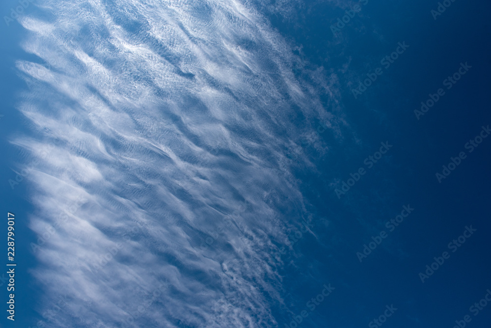 Fototapeta premium Shapes on blue sky with clouds.