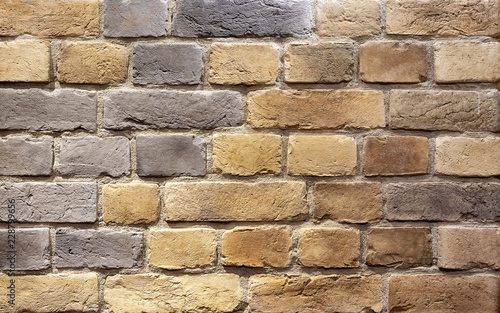 Background of brown building bricks. A wall of bricks.