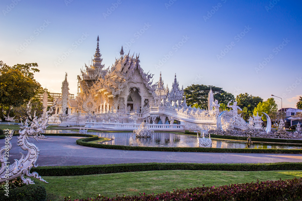 Fototapeta premium Beautiful and amazing white art temple at Wat Rong Khun Chiang Rai, Thailand It is a tourist destination. Landmark of Chiang Rai