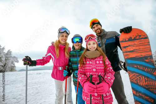 family enjoying winter vacations in mountains. Ski, Sun, Snow and fun