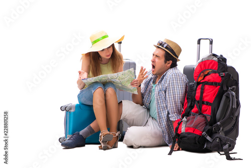 Young family preparing for vacation travel on white © Elnur