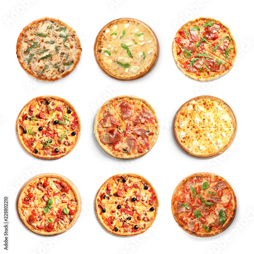 Set with different delicious pizzas on white background, top view