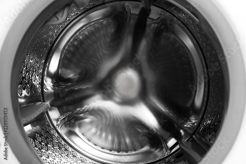 Empty washing machine drum, closeup. Laundry day