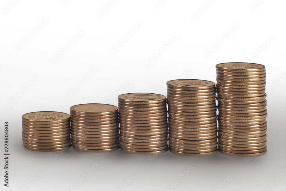 Business diagram on financial report with coins. Stack of coins placed as diagram. Isolated on white background Business diagram on financial report with coins. Stack of coins placed as diagram. Isolated on white background