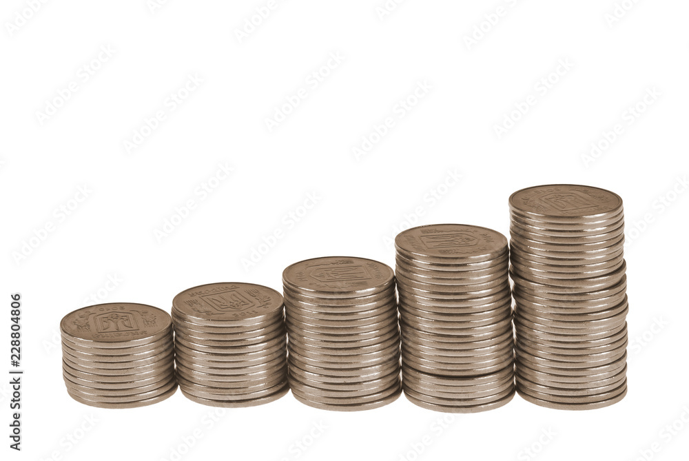 Business diagram on financial report with coins. Stack of coins placed as diagram. Isolated on white background Business diagram on financial report with coins. Stack of coins placed as diagram. Isolated on white background