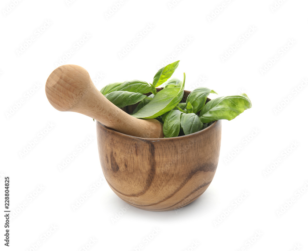 Mortar with fresh green basil leaves on white background