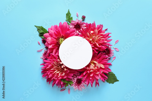 Fototapeta Naklejka Na Ścianę i Meble -  Flat lay composition with beautiful dahlia flowers and blank card on color background
