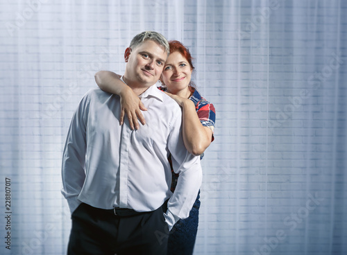 Couple man and woman husband and wife dancing having fun indoors at home in the room