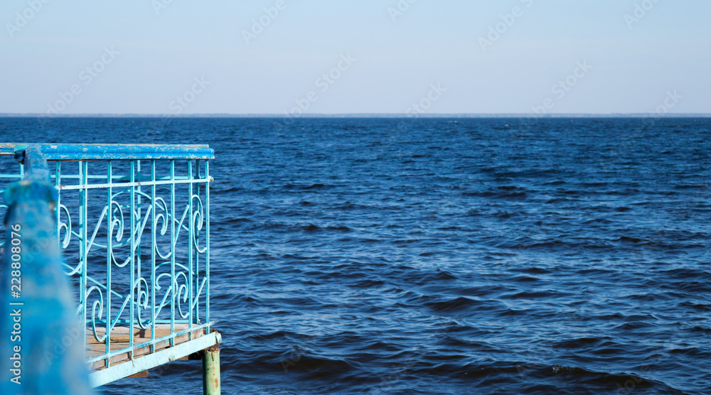 Water surface with wharf on Kyiv Sea, autumn Water surface with wharf on Kyiv Sea, autumn