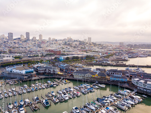 Beautiful aerial view of the San Francisco docks with many piers including pier 39 and Alcatraz prison in the middle of the bay. photo